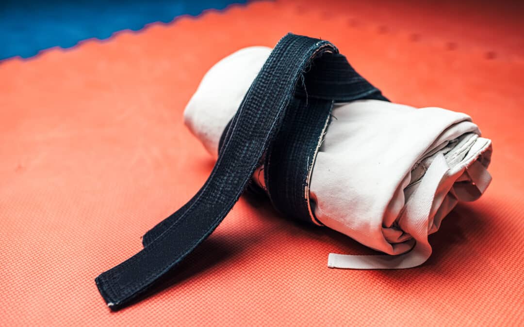 Martial arts jacket tied with black belt