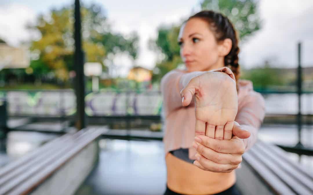 Athlete Performing Wrist Stretches to Prevent Wrist Pain